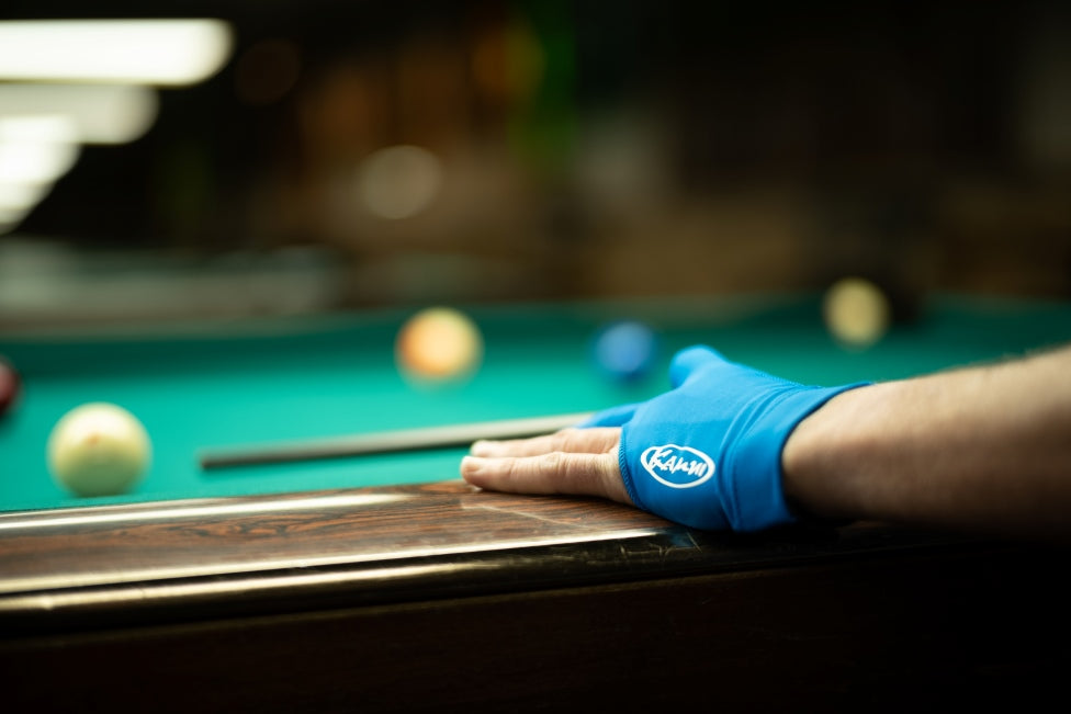 Billiard glove worn on a bridge hand while lining up a shot
