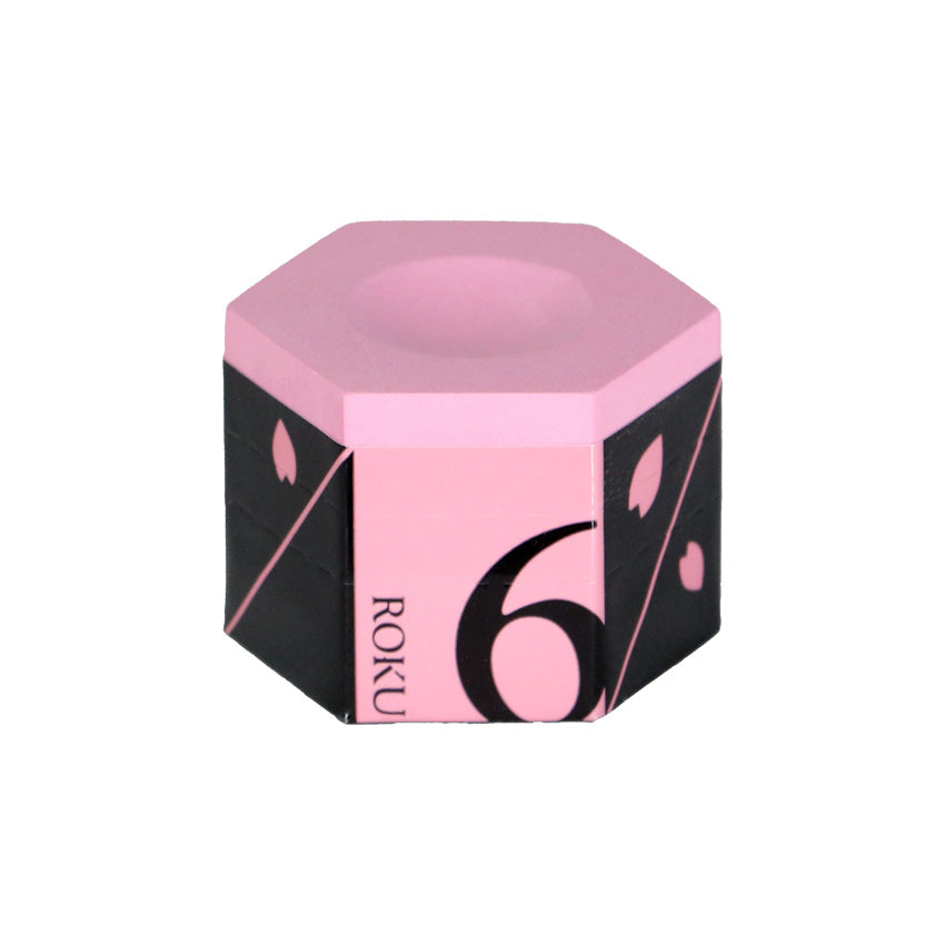 Hexagonal pink and black product with 'ROKU' branding on a white background