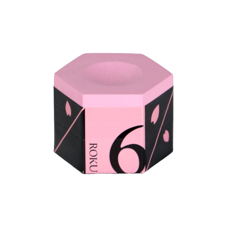 Hexagonal pink and black product with 'ROKU' branding on a white background