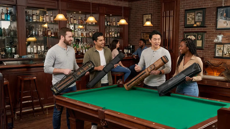 4 players gather around a pool table comparing cue cases